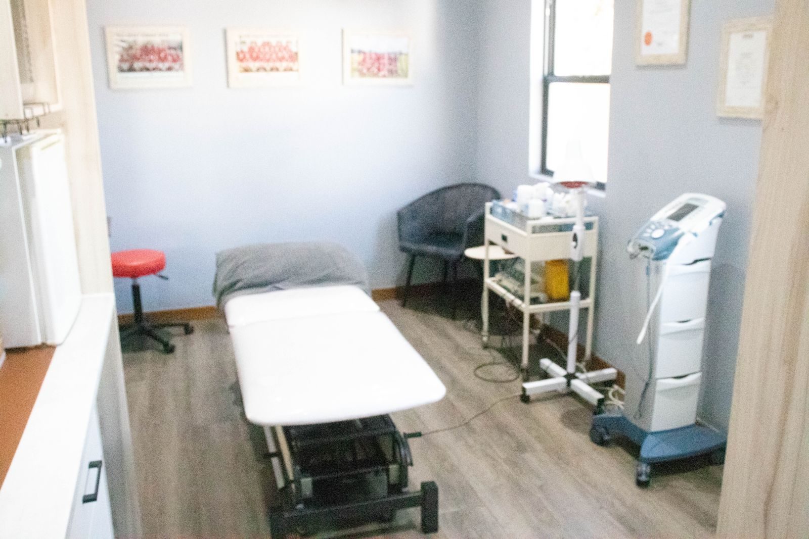 Peak Physiotherapy treatment room with adjustable bed and equipment